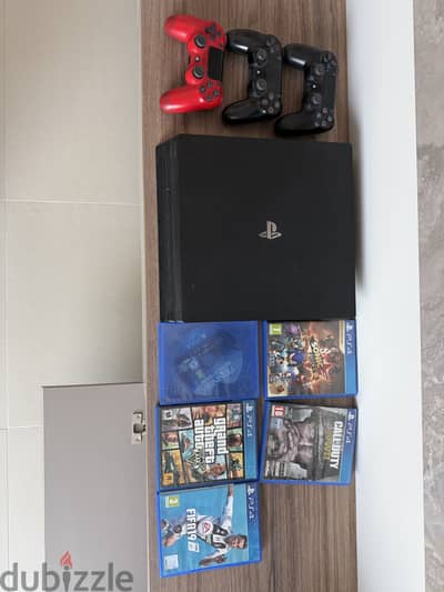 Sony Playstation 4 Pro + 3 Controllers + 5 PS4 games Bundle